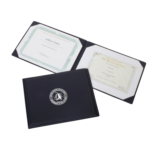 Dark blue U.S. Space Force award certificate binder, NSN 7510-01-738-2331, showing the silver seal and open interior with two sample certificates.