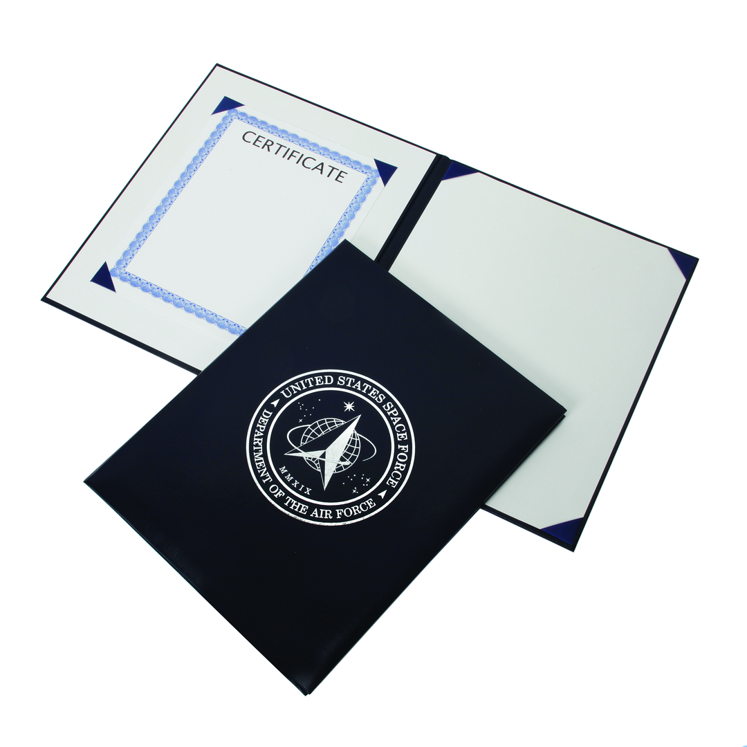 Large dark blue U.S. Space Force award certificate binder with silver seal, shown open with corner ribbons and closed. NSN 7510-01-738-2332.
